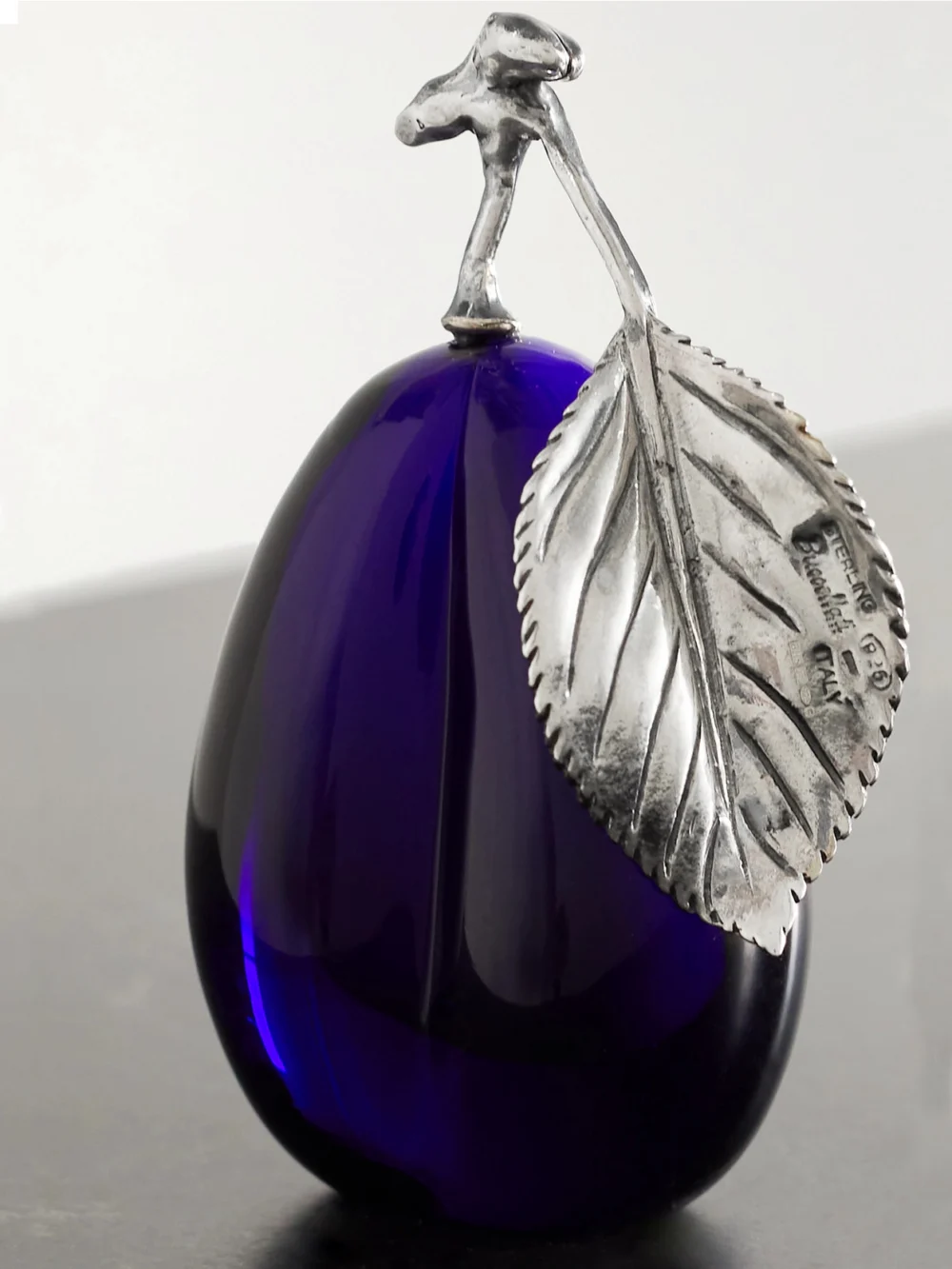 Close-up detail of the Buccellati Plum Sterling Silver and Glass Table Marker