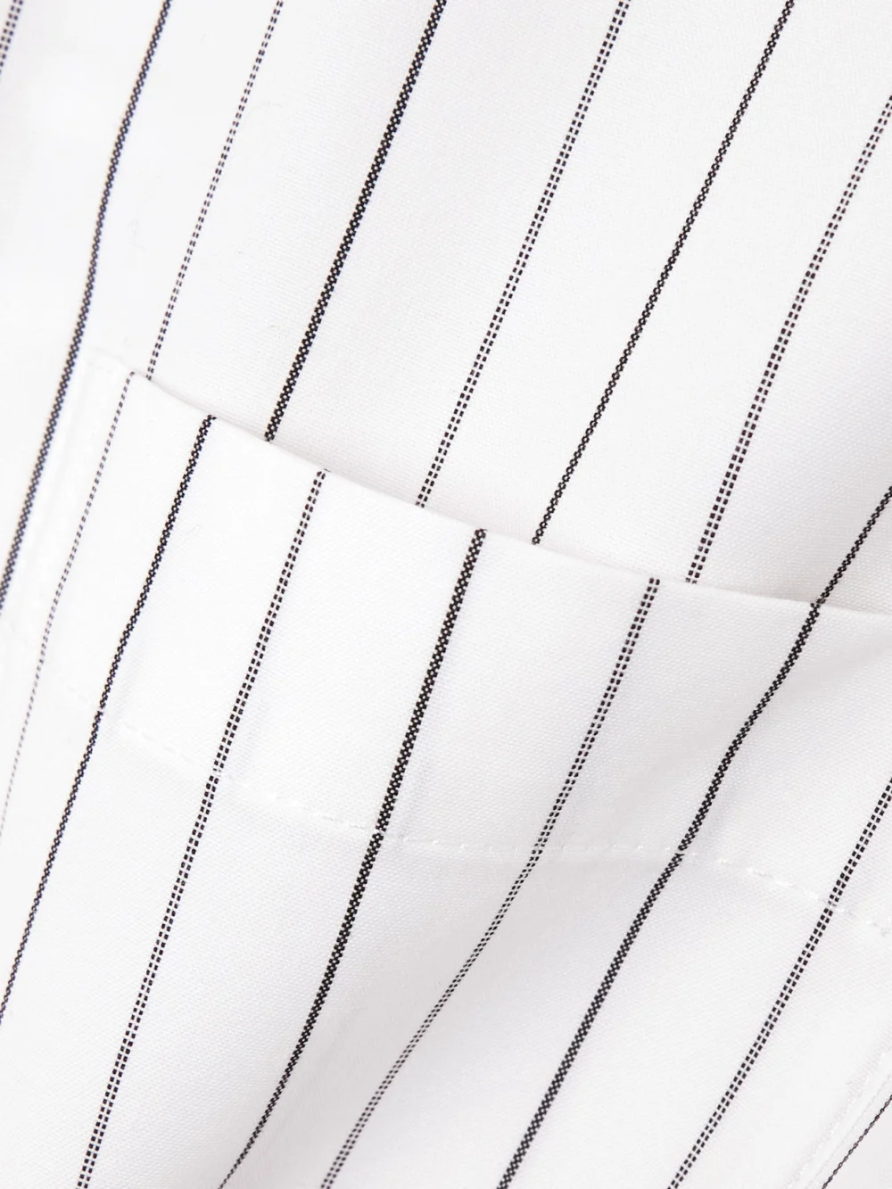 Close-up detail of the Burberry Belted Pinstriped Cotton-poplin Shirt