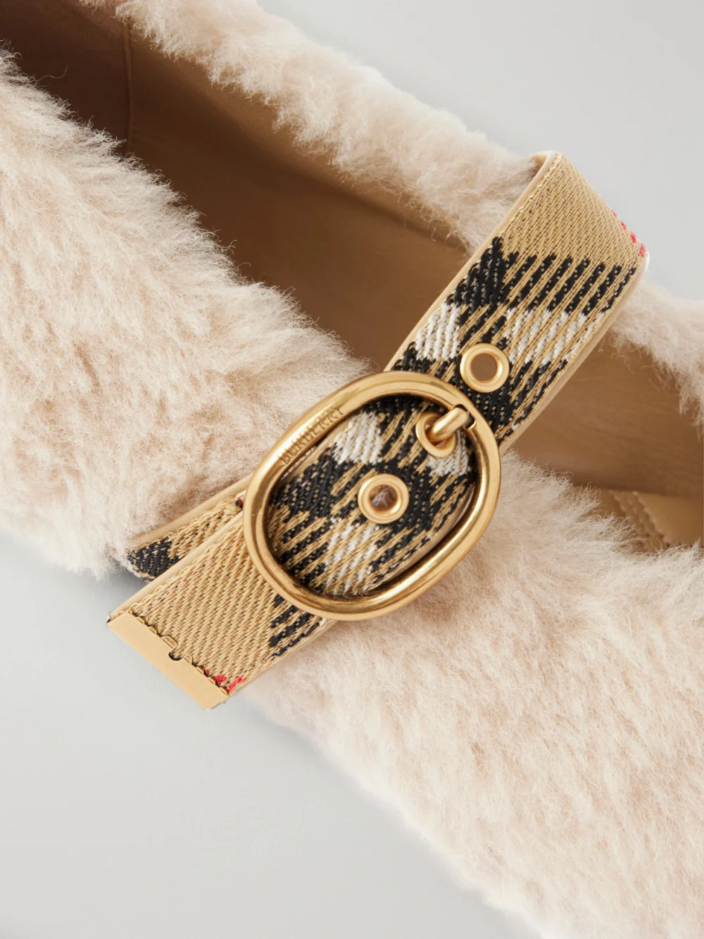 Close-up detail of the Burberry Buckle-detailed Check-trimmed Shearling Ballet Flats