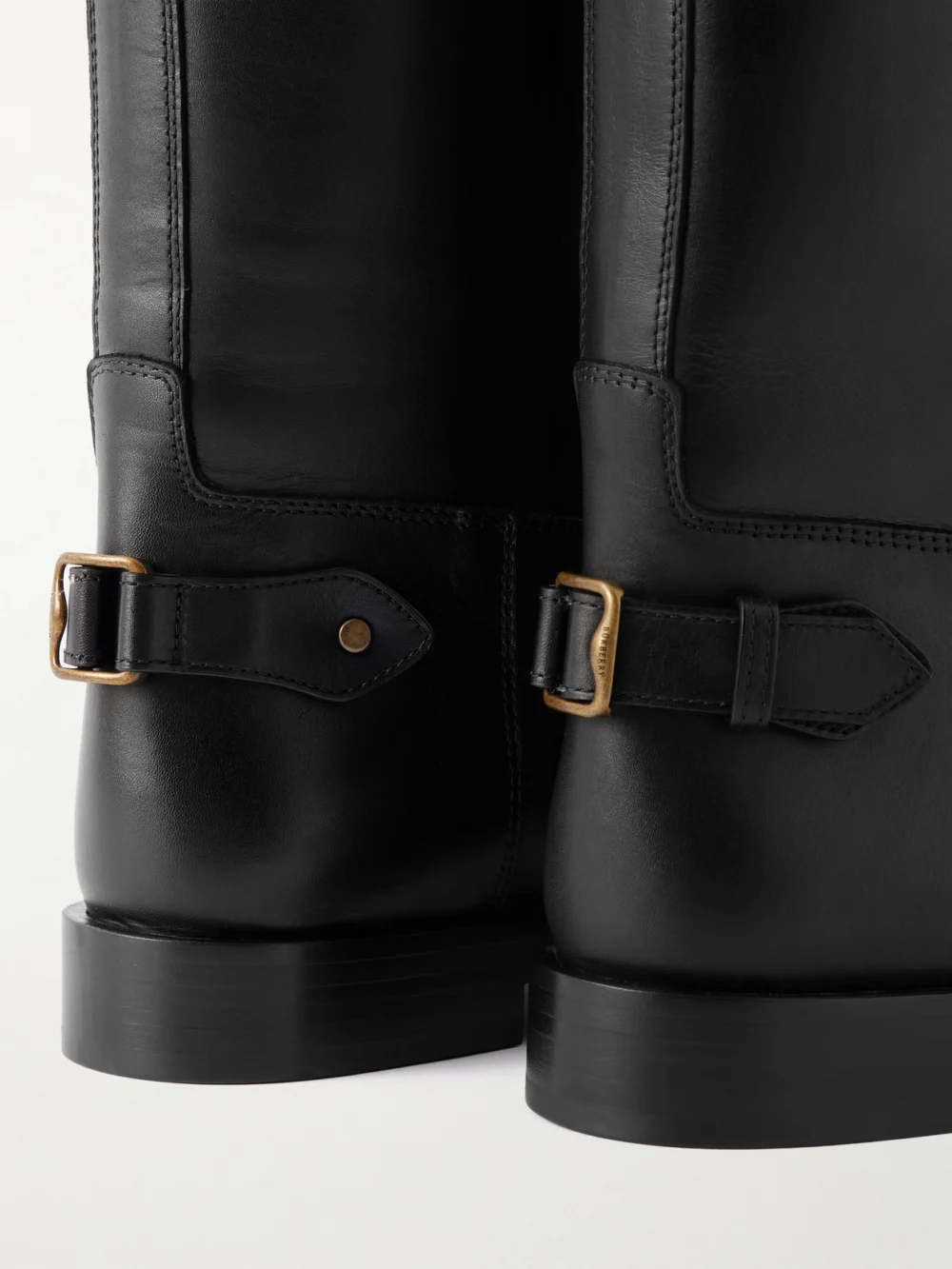 Close-up detail of the Burberry Buckled Leather Knee Boots