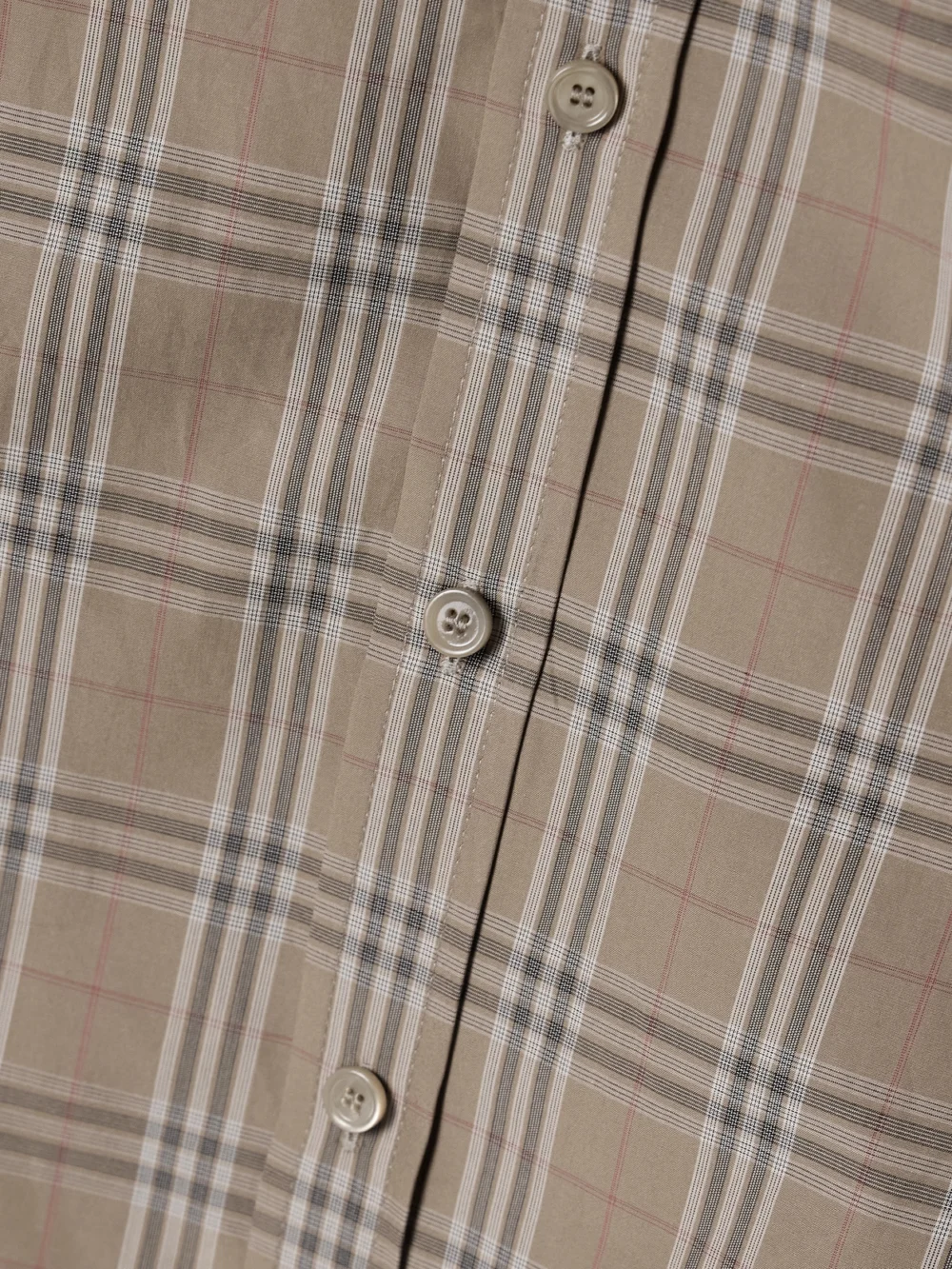 Close-up detail of the Burberry Buckled Ruched Checked Cotton-poplin Shirt