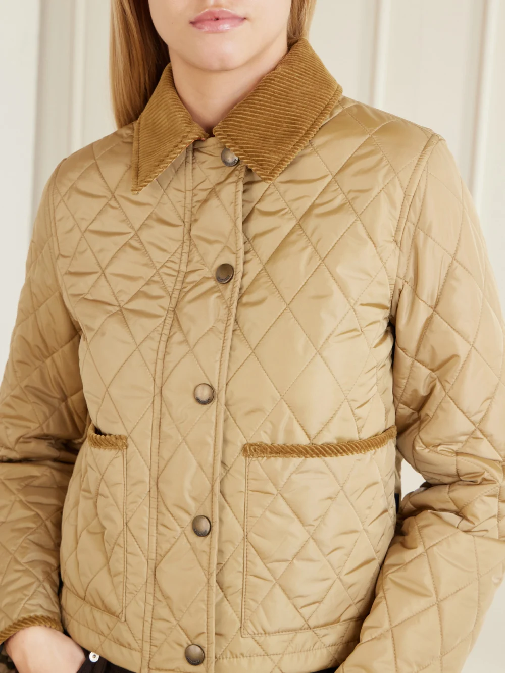 Close-up detail of the Burberry Cropped Corduroy-trimmed Quilted Shell Jacket