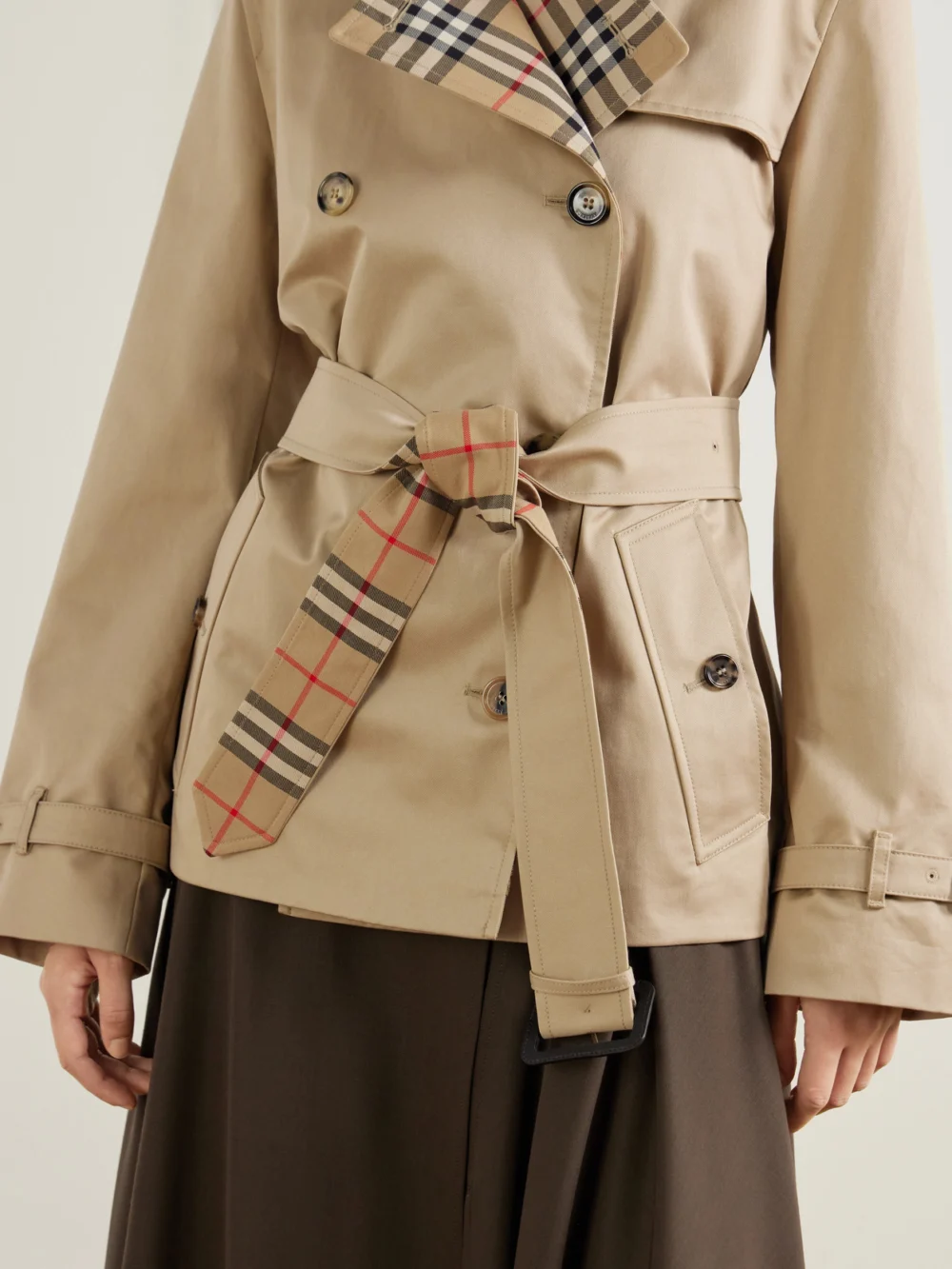 Close-up detail of the Burberry Double-breasted Belted Checked Cotton-gabardine Trench Coat