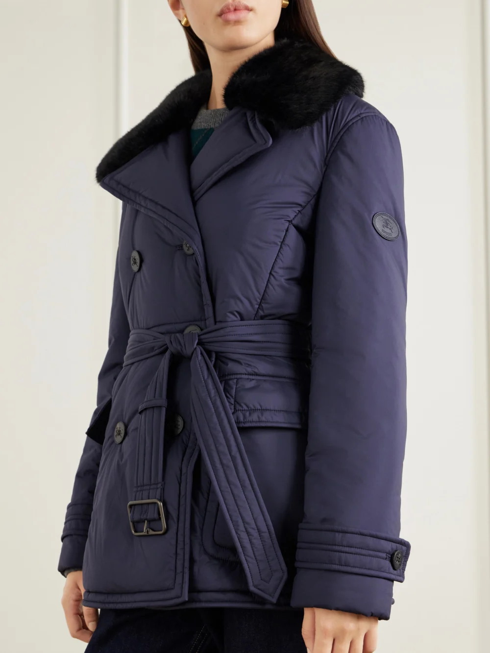 Close-up detail of the Burberry Double-breasted Belted Padded Plush-trimmed Shell Jacket
