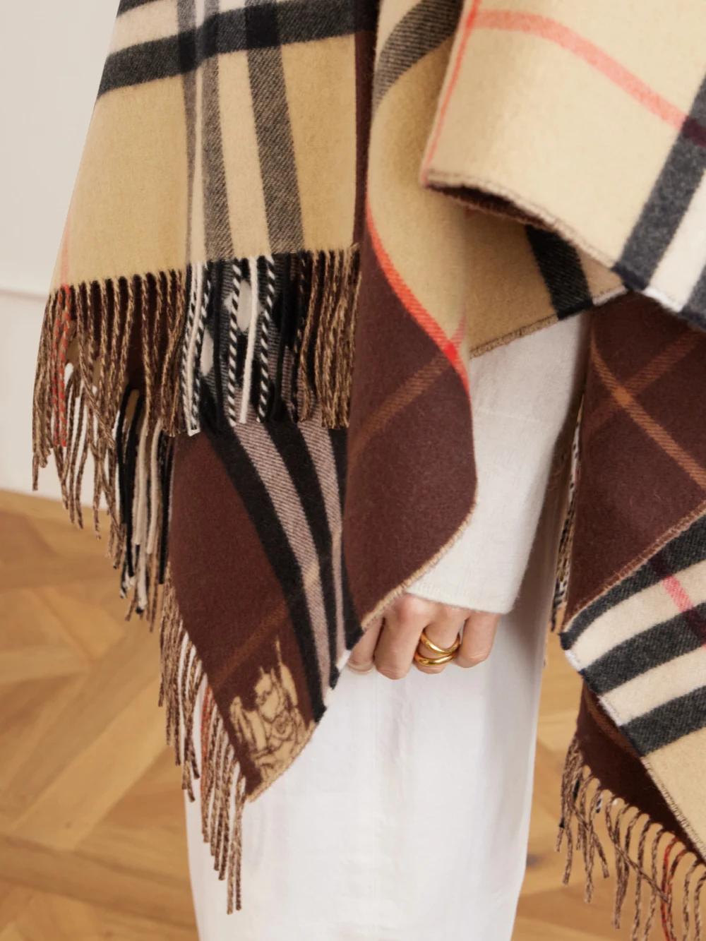Close-up detail of the Burberry Fringed Checked Cashmere and Wool-blend Cape