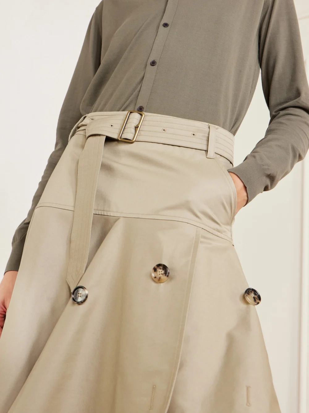 Close-up detail of the Burberry Heather Belted Asymmetric Cotton-gabardine Midi Skirt