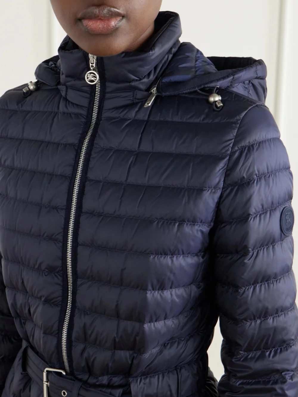 Close-up detail of the Burberry Hooded Belted Quilted Shell Coat