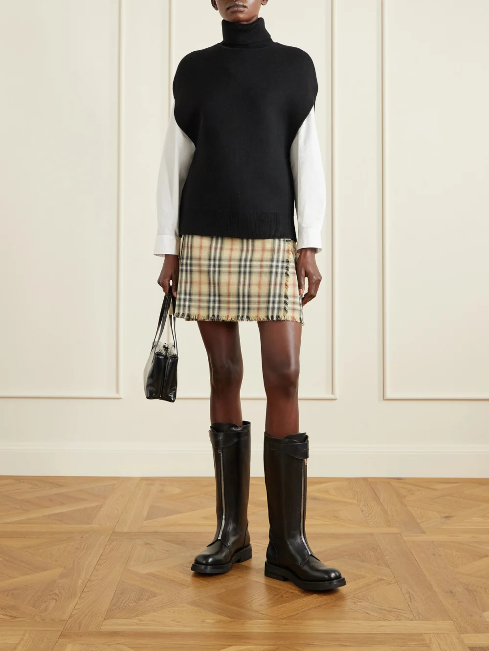 Burberry Leather-trimmed Pleated Checked Wool Mini Skirt, worn by a model