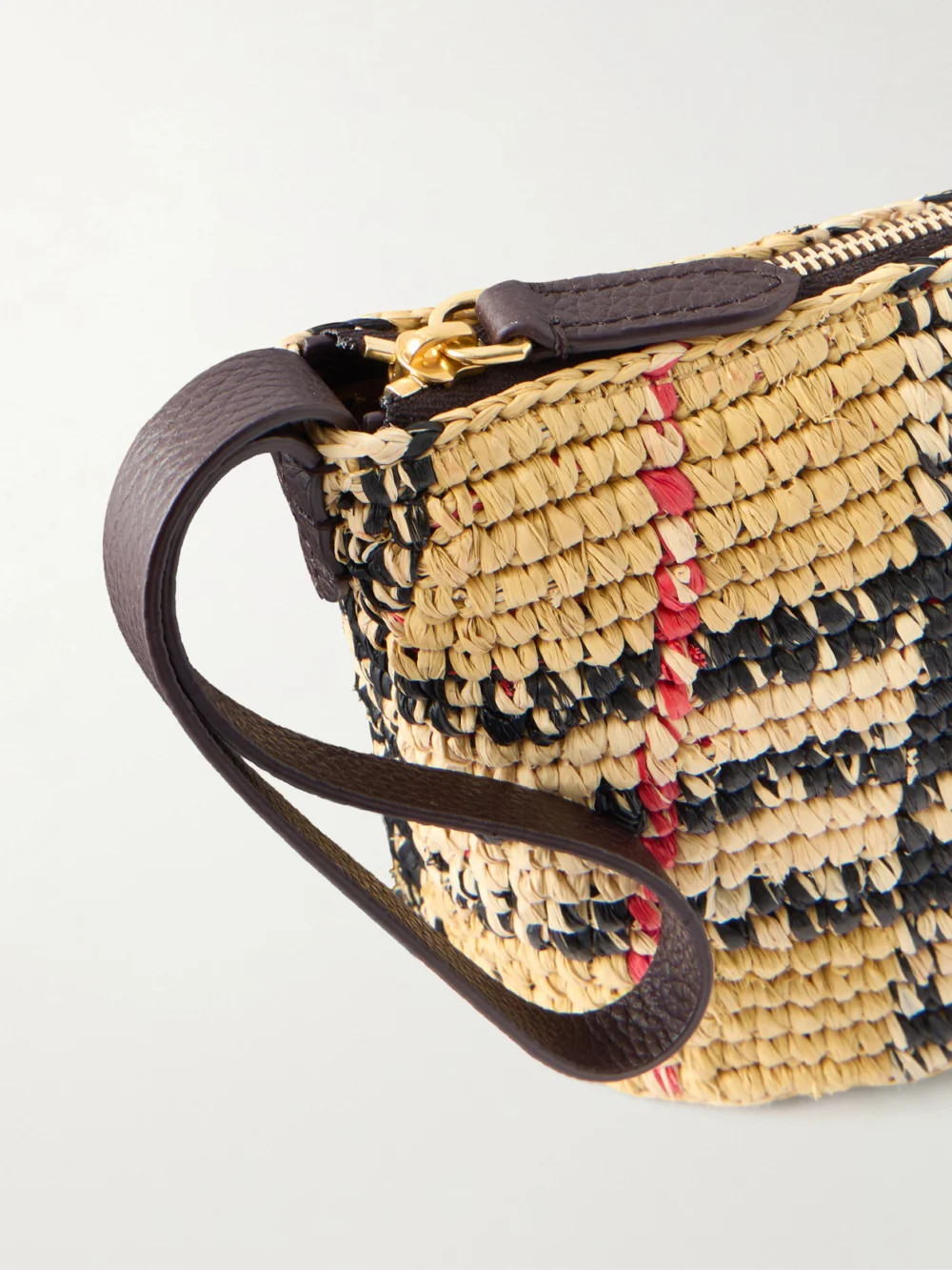 Close-up detail of the Burberry Margate Leather-trimmed Woven Raffia Clutch Bag