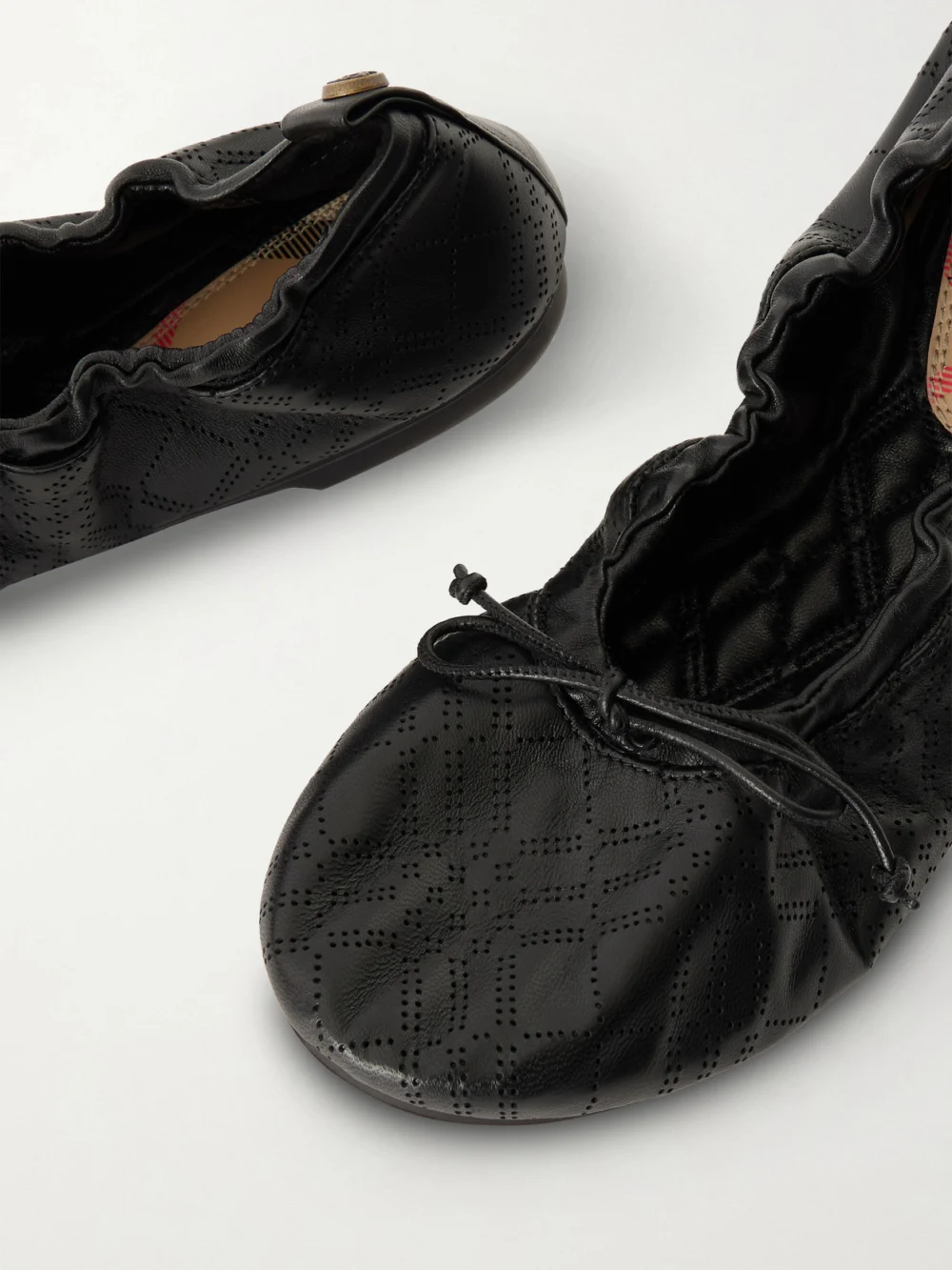 Close-up detail of the Burberry Perforated Leather Ballet Flats