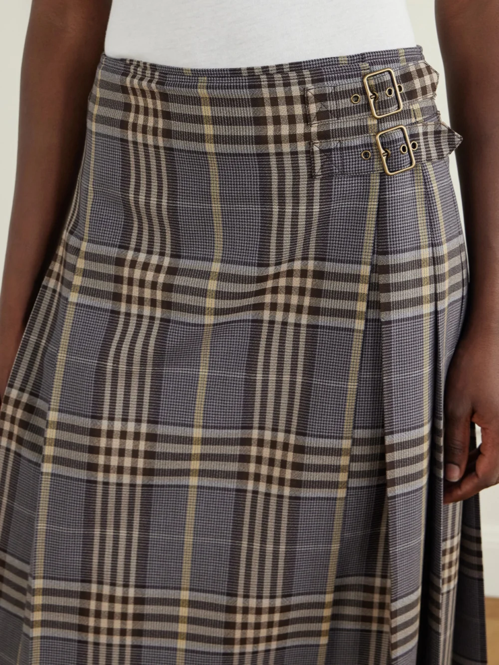 Close-up detail of the Burberry Pleated Checked Wool Midi Skirt