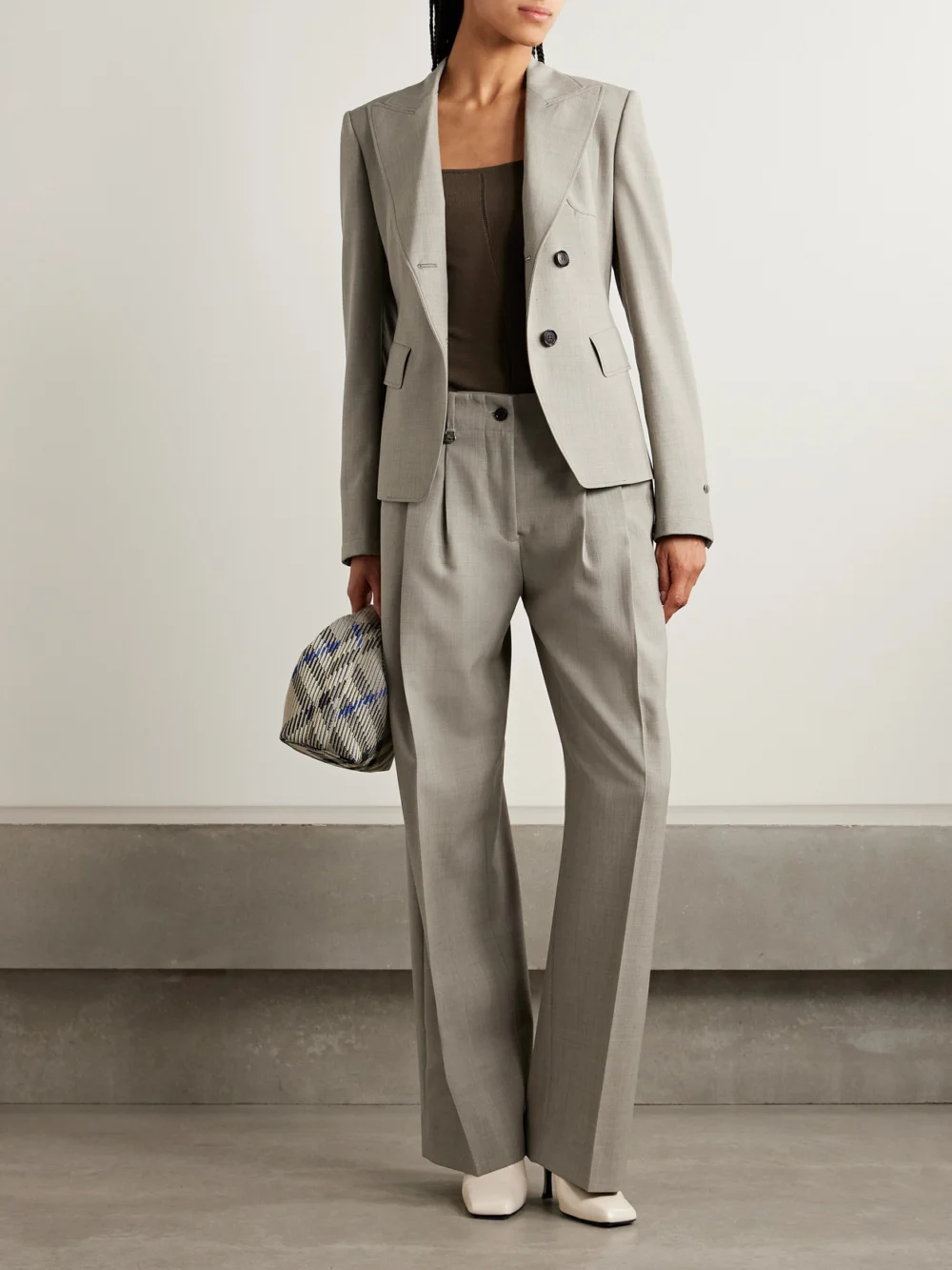 Burberry Pleated Wool Tapered Pants, worn by a model
