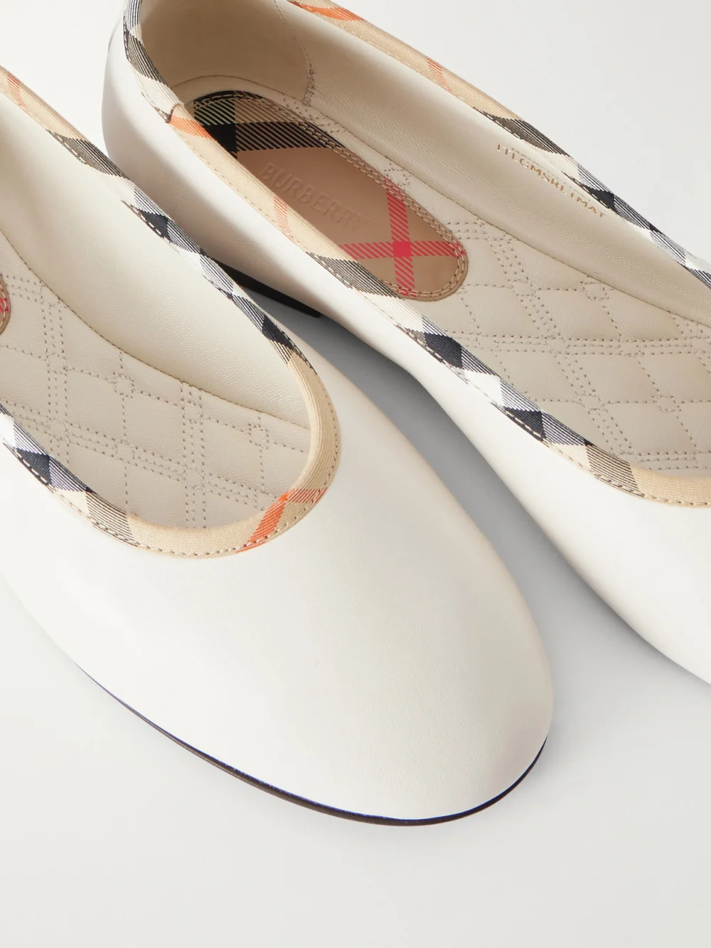 Close-up detail of the Burberry Robin Check Trim Leather Ballet Flats