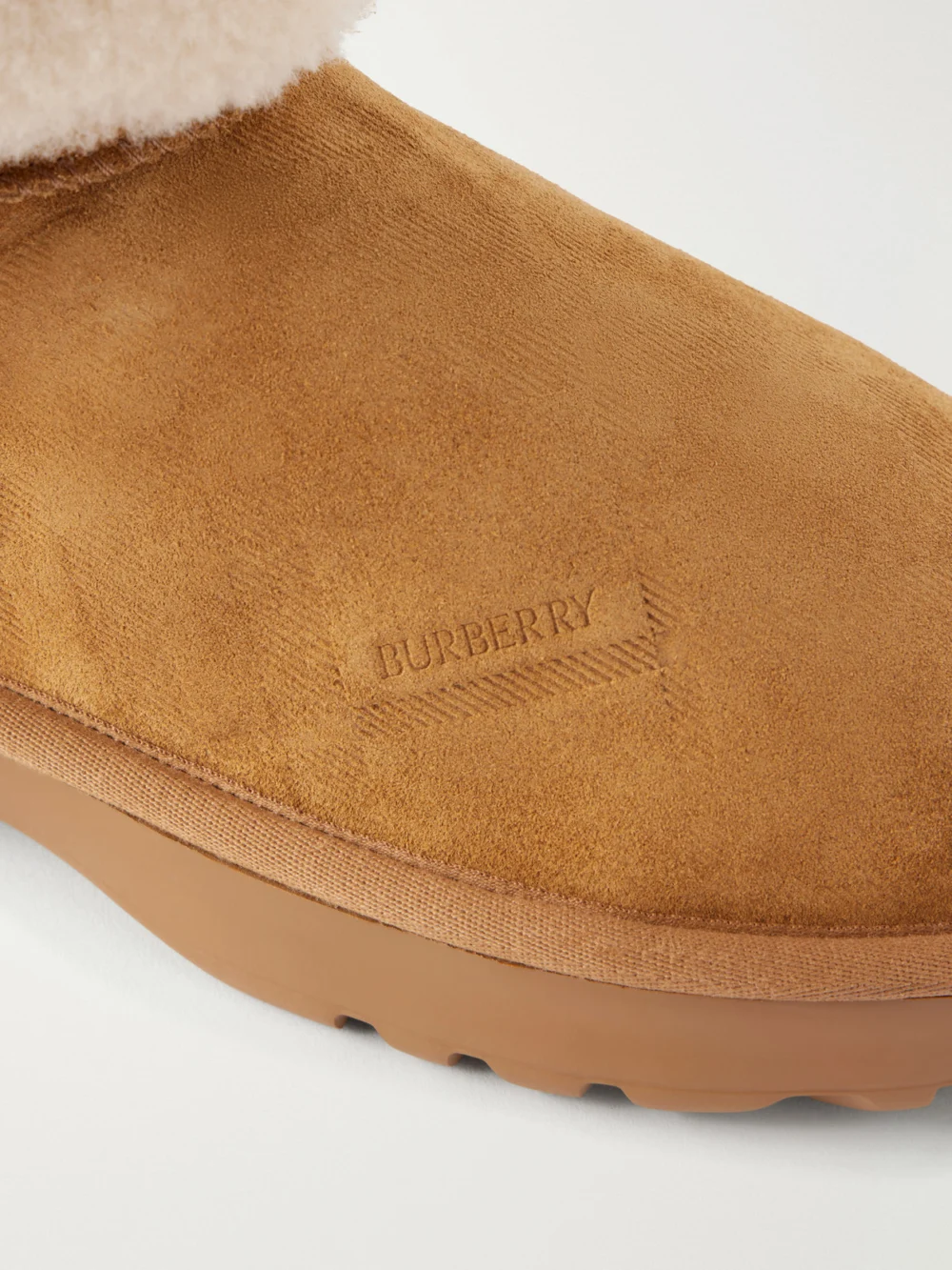 Close-up detail of the Burberry Shearling-trimmed Suede Ankle Boots