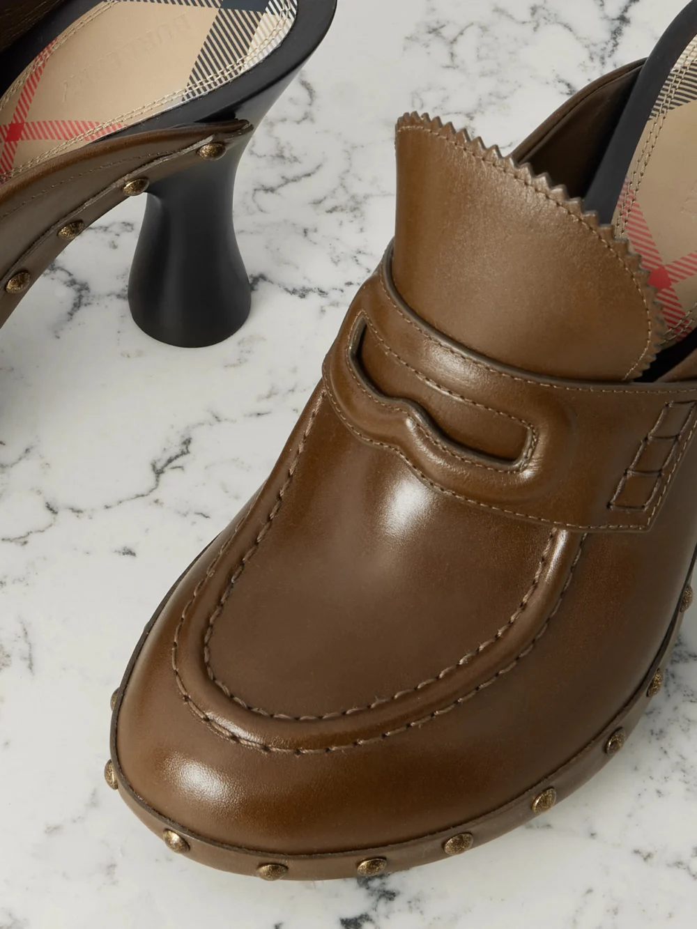 Close-up detail of the Burberry Studded Leather Mules
