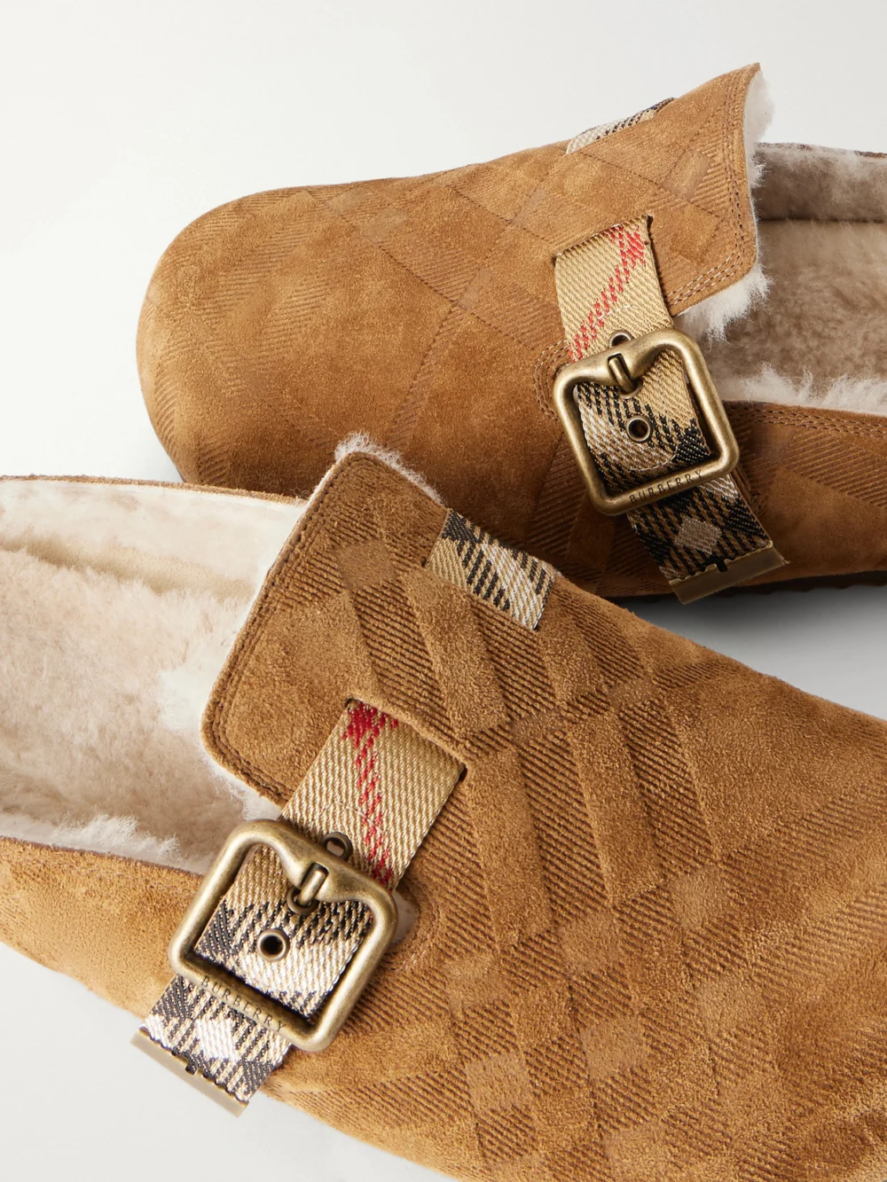 Close-up detail of the Burberry Urchin Check Shearling-trimmed Clogs