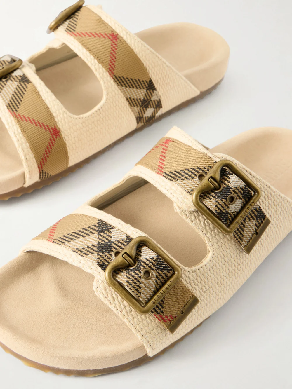 Close-up detail of the Burberry Urchin Woven Raffia Sandals