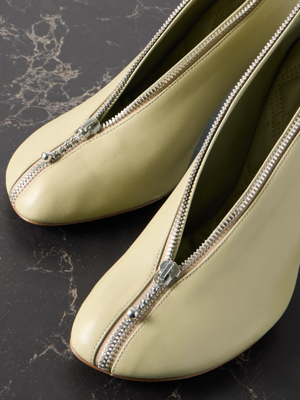 Close-up detail of the Burberry Zip-embellished Leather Pumps