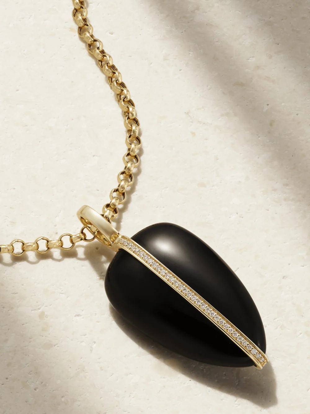 Close-up detail of the By Pariah Pebble 14-karat Recycled Gold, Onyx and Diamond Pendant
