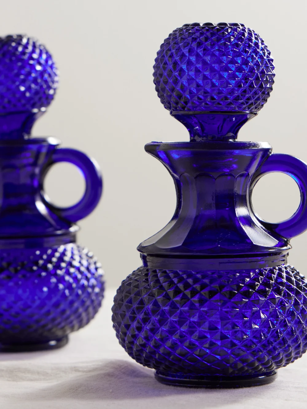 Close-up detail of the Cabana Galeano Glass Oil and Vinger Bottle Set