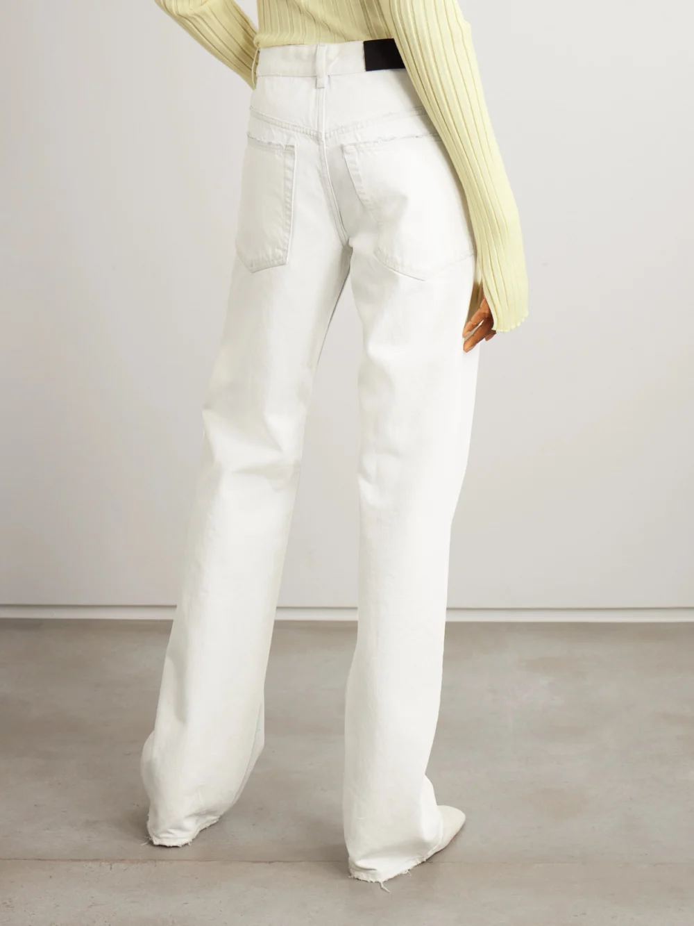 Back view of the Calvin Klein Collection Distressed Mid-rise Straight-leg Jeans