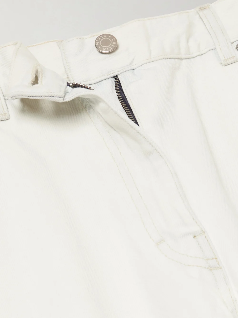 Close-up detail of the Calvin Klein Collection Distressed Mid-rise Straight-leg Jeans