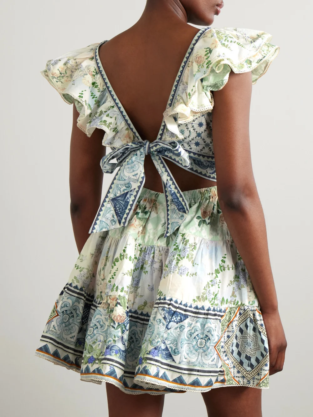 Back view of the Camilla Cutout Ruffled Printed Organic Cotton Mini Dress