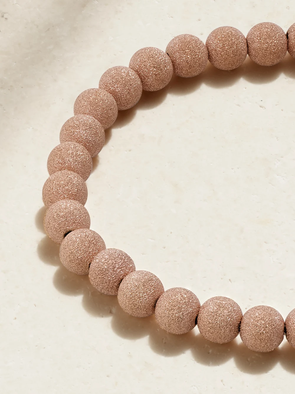 Close-up detail of the Carolina Bucci Florentine Finish 18-karat Rose Gold Beaded Bracelet