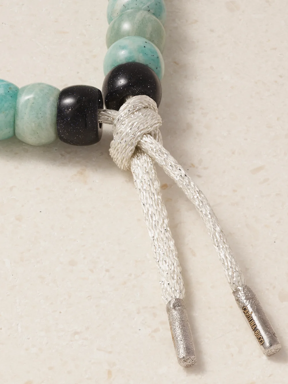 Back view of the Carolina Bucci Forte Beads New York 18-karat Yellow and White Gold, Amazonite and Goldstone Bracelet