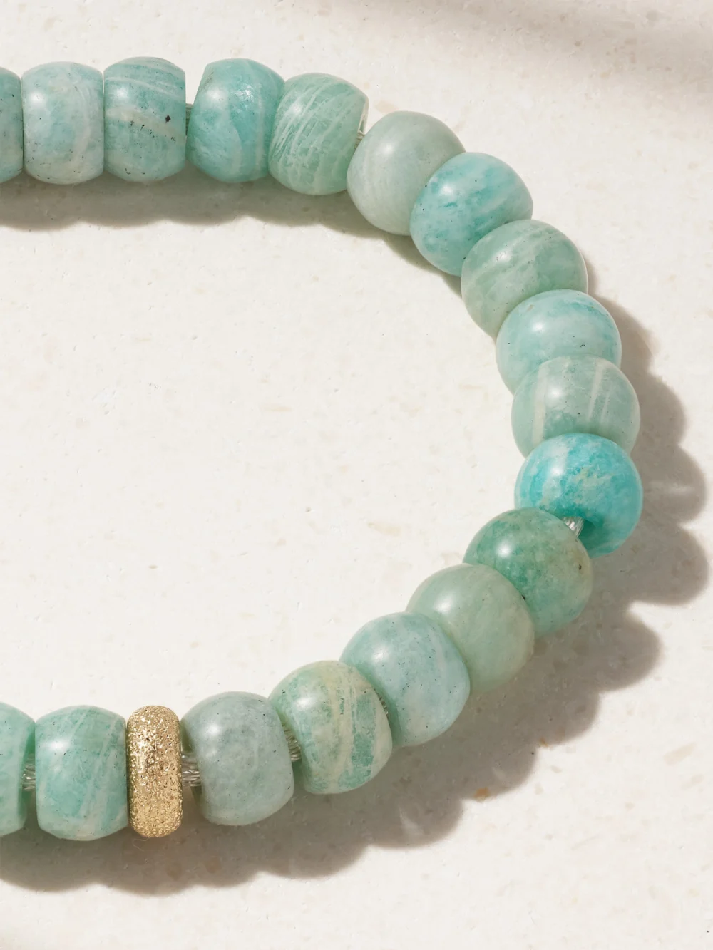 Close-up detail of the Carolina Bucci Forte Beads New York 18-karat Yellow and White Gold, Amazonite and Goldstone Bracelet