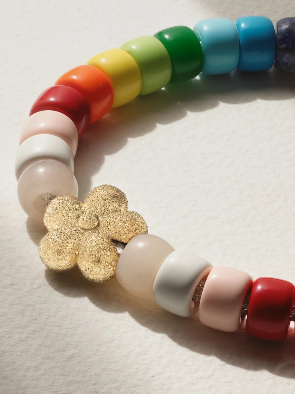 Close-up detail of the Carolina Bucci Forte Beads Rainbow Flower 18-karat Gold, Lurex and Multi-stone Bracelet Kit