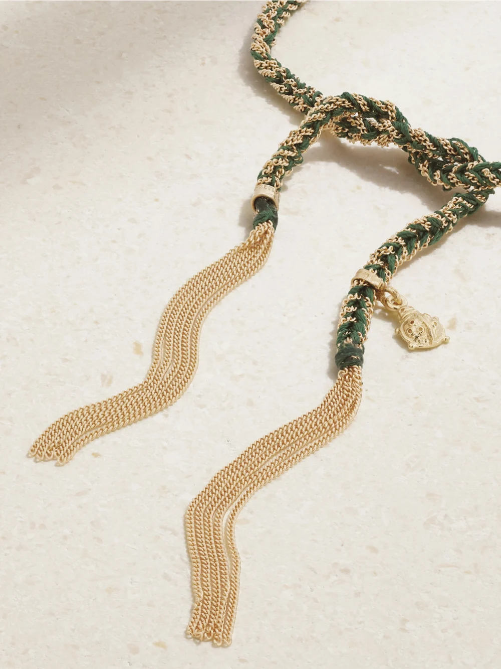 Close-up detail of the Carolina Bucci Lucky Fortune + Ladybug 18-karat Gold and Silk Bracelet