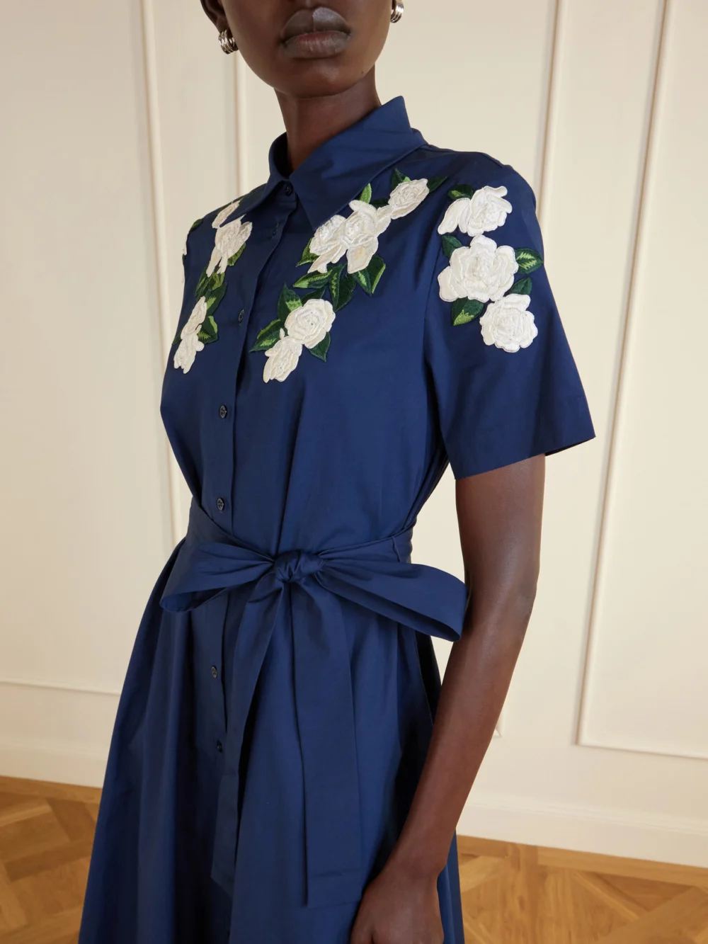 Close-up detail of the Carolina Herrera Belted Floral-embroidered Cotton-blend Midi Dress