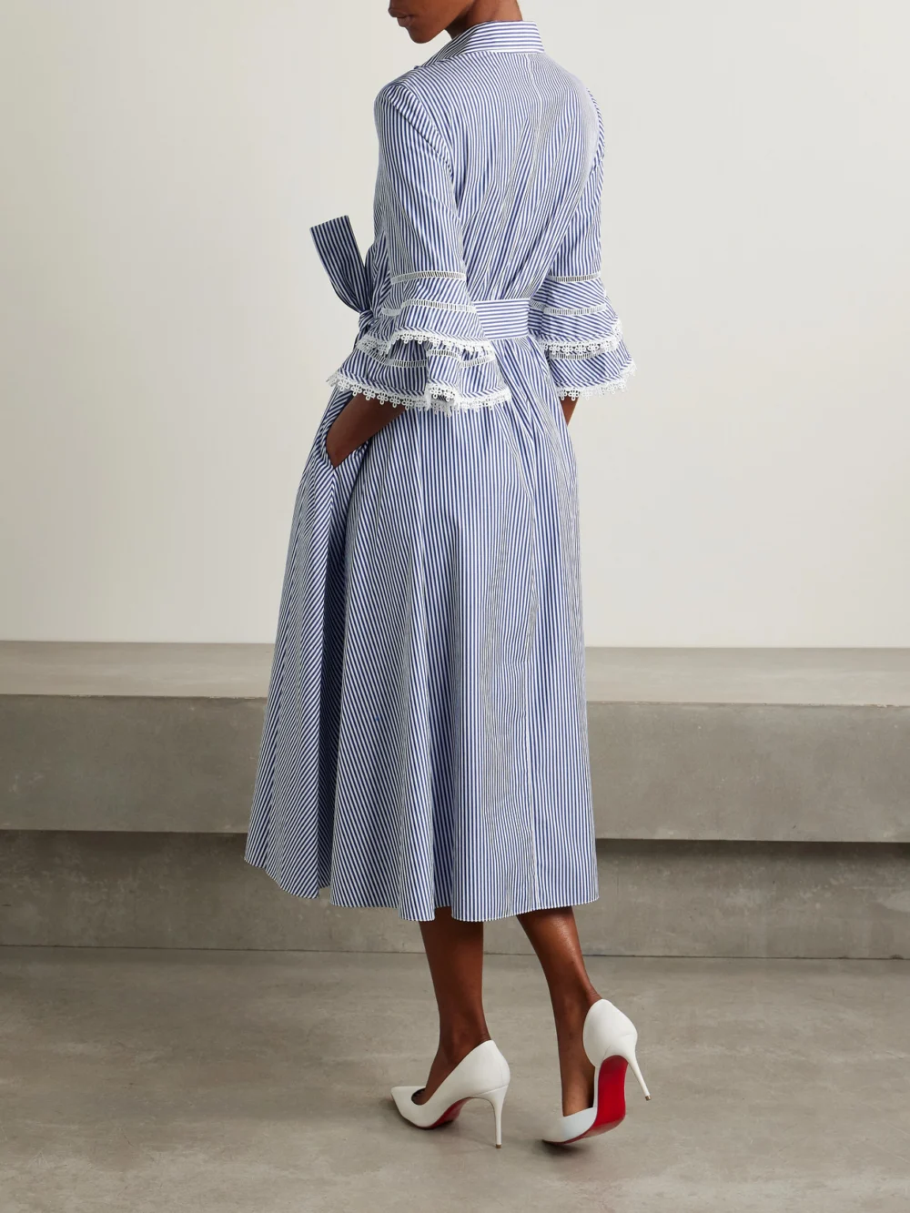 Back view of the Carolina Herrera Belted Guipure Lace-trimmed Striped Cotton-poplin Midi Shirt Dress