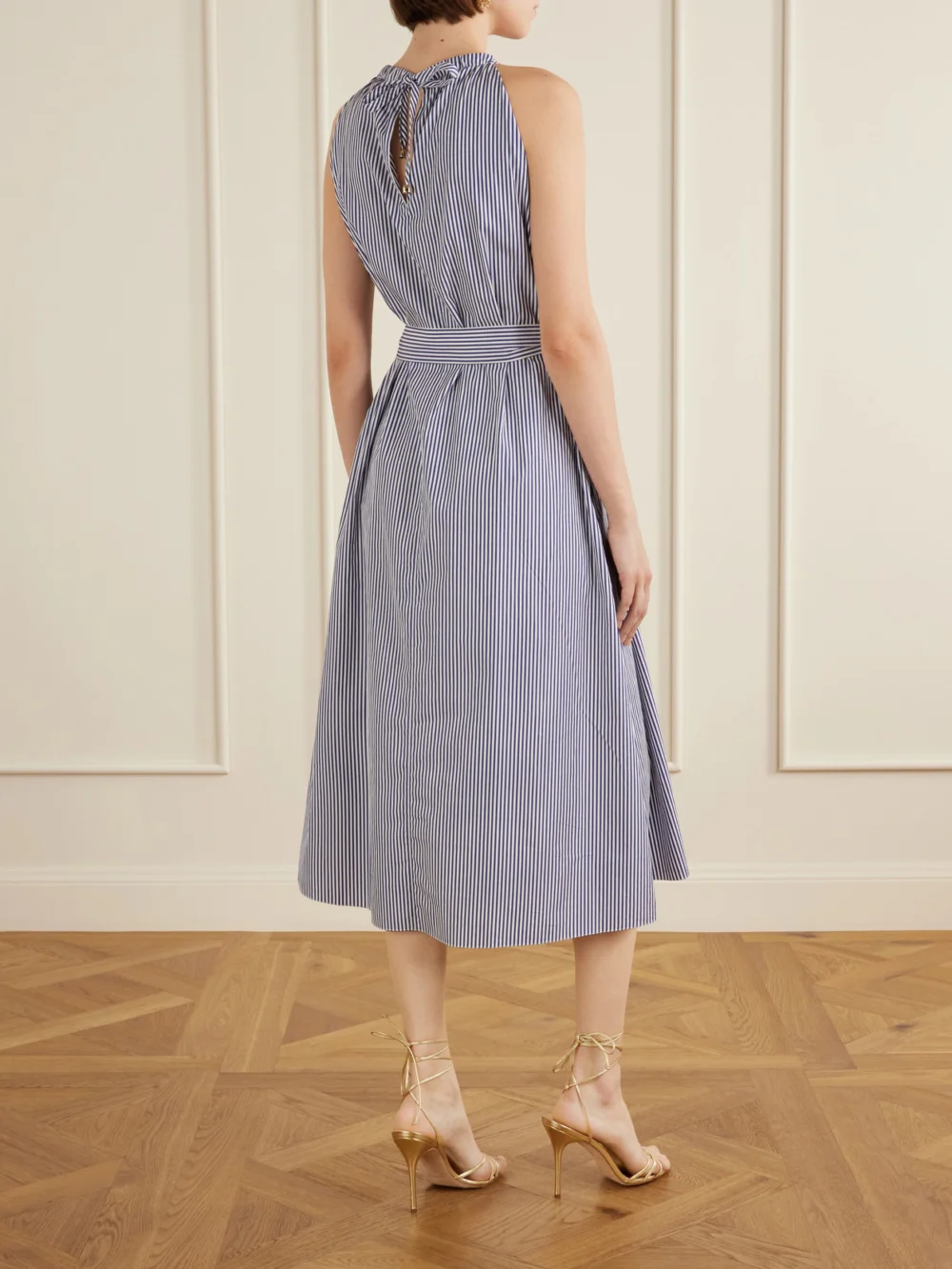 Back view of the Carolina Herrera Belted Striped Embroidered Cotton-poplin Halterneck Midi Dress