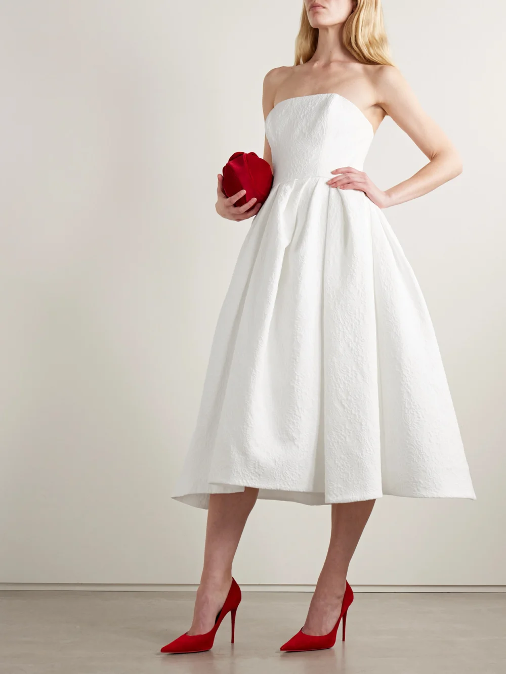 Carolina Herrera Strapless Pleated Cotton-blend Cloqué Midi Dress, worn by a model