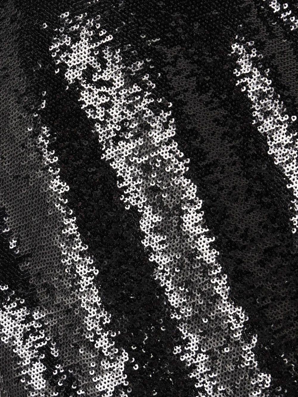 Close-up detail of the Carolina Herrera Strapless Sequined Tulle Midi Dress