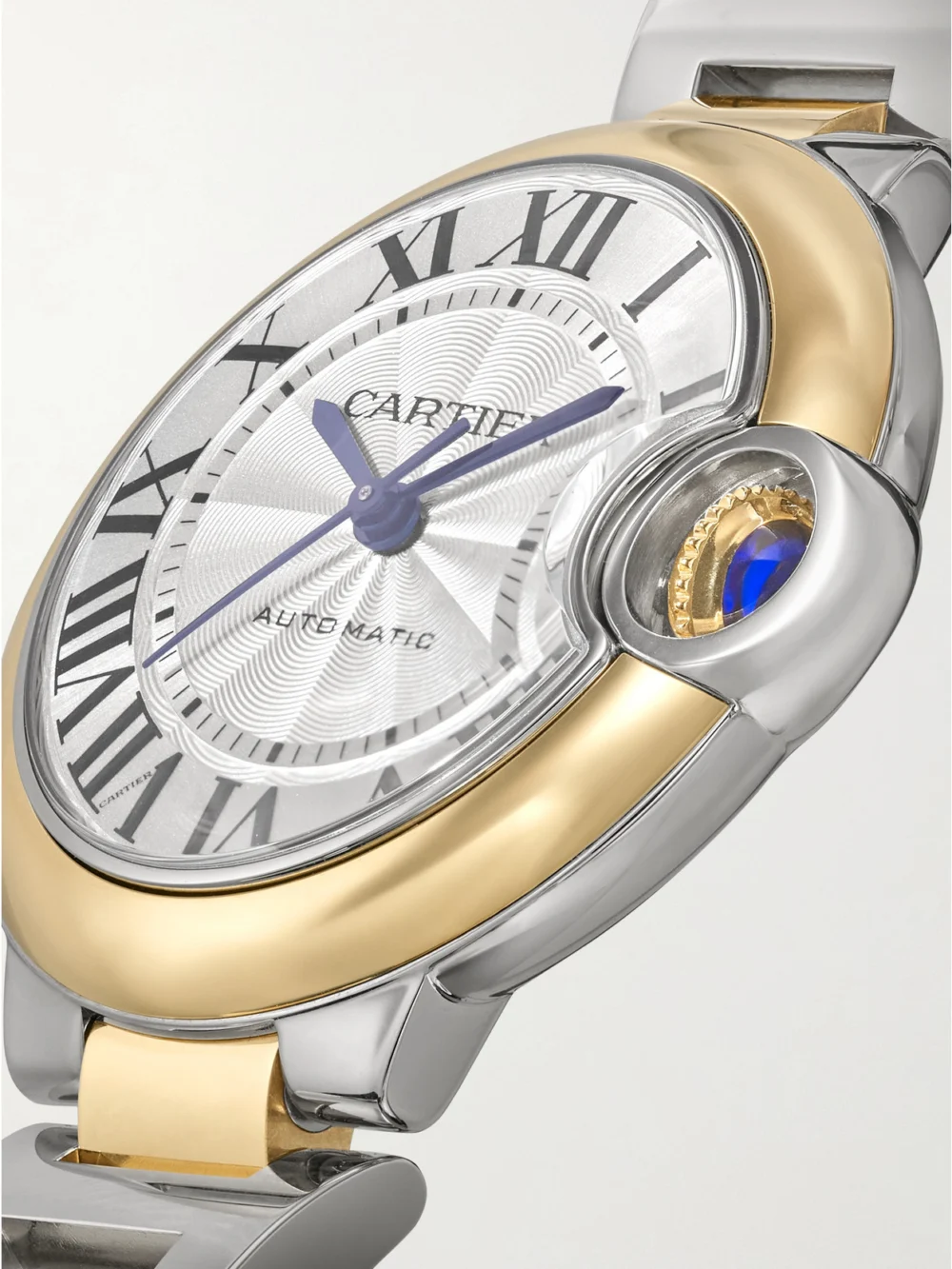 Close-up detail of the Cartier Ballon Bleu De Cartier Automatic 18-karat Gold and Stainless Steel Watch, Ref. Crw2bb0037