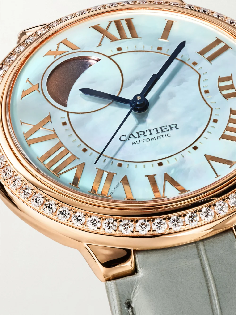 Close-up detail of the Cartier Ballon Bleu De Cartier Automatic 18-karat Rose Gold Diamond Watch