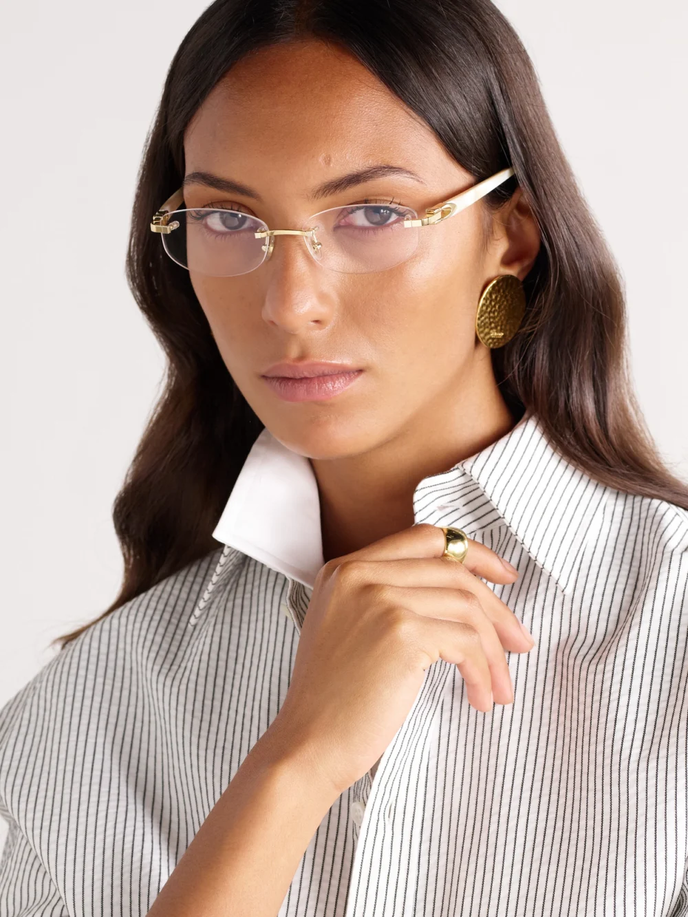 Cartier Eyewear Oval-frame Rimless Gold-tone and Acetate Optical Glasses, styled view