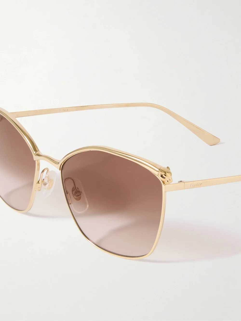 Close-up detail of the Cartier Eyewear Panthère Classic Cat-eye Gold-tone Sunglasses