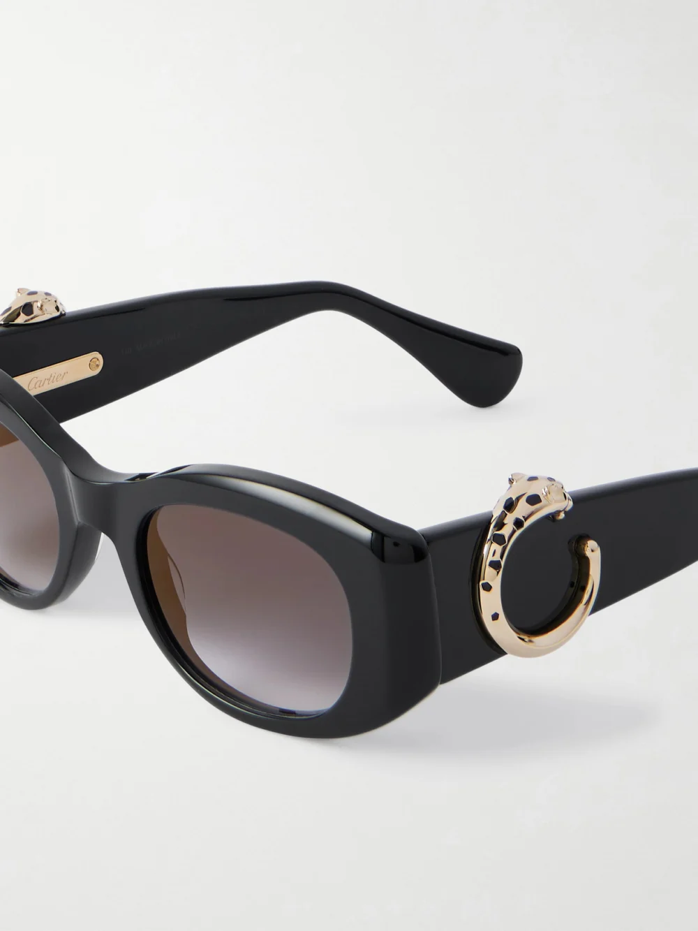 Close-up detail of the Cartier Eyewear Panthère Classic Oval-frame Acetate Sunglasses