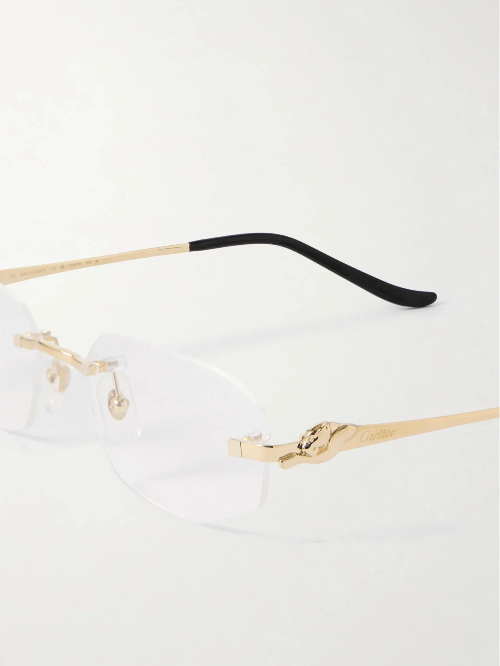 Close-up detail of the Cartier Eyewear Panthère Classic Rimless Oval-frame Gold-tone Optical Glasses
