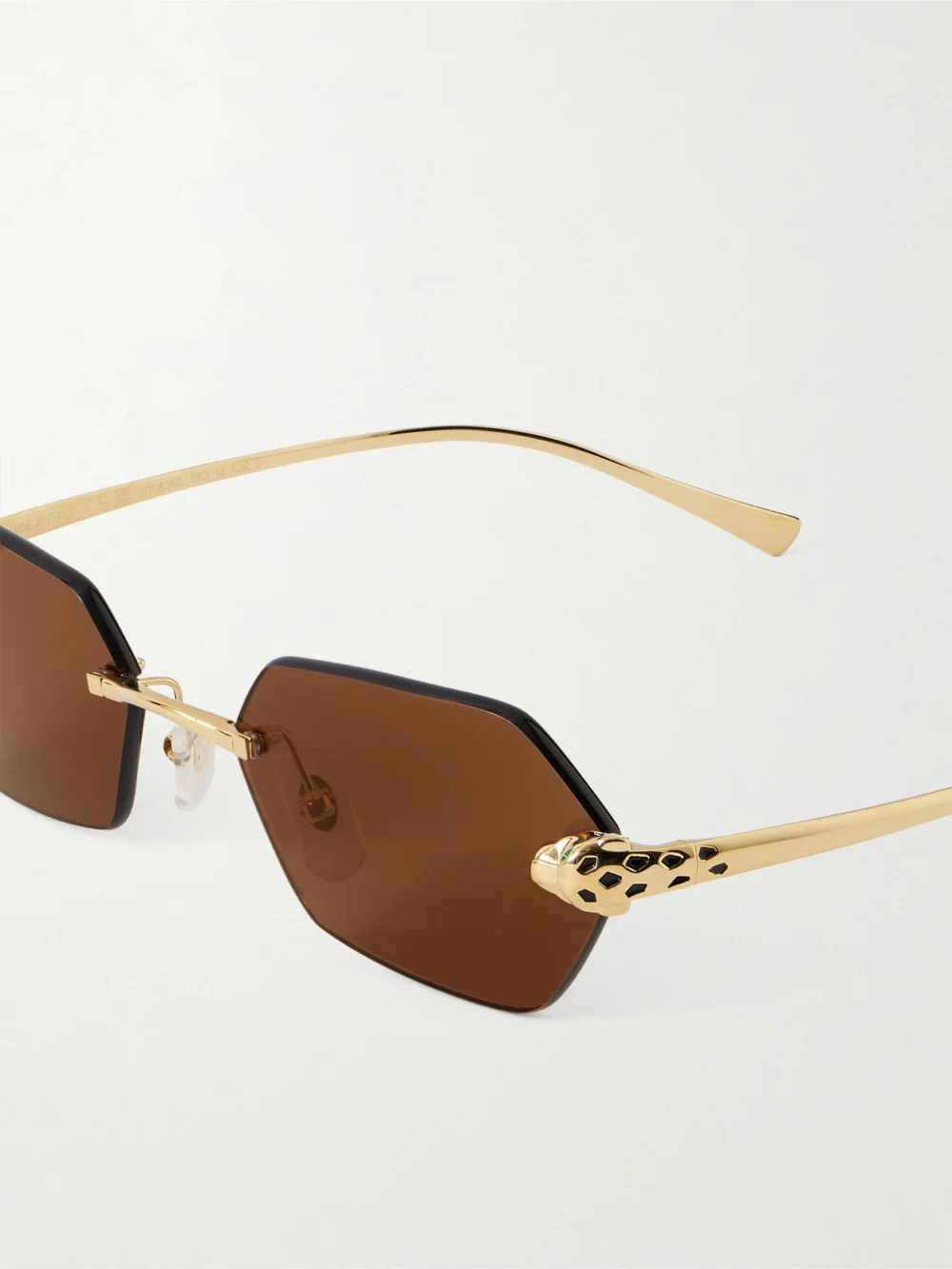 Close-up detail of the Cartier Eyewear Panthère De Cartier Rimless Hexagon-frame Gold-tone Sunglasses