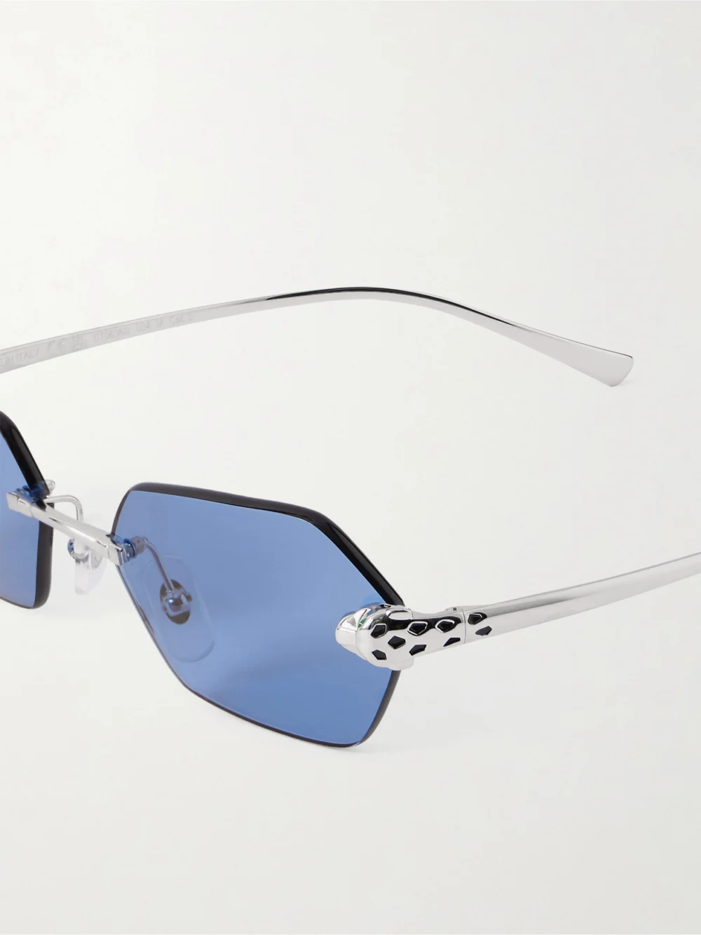 Close-up detail of the Cartier Eyewear Panthère De Cartier Rimless Hexagon-frame Silver-tone Sunglasses