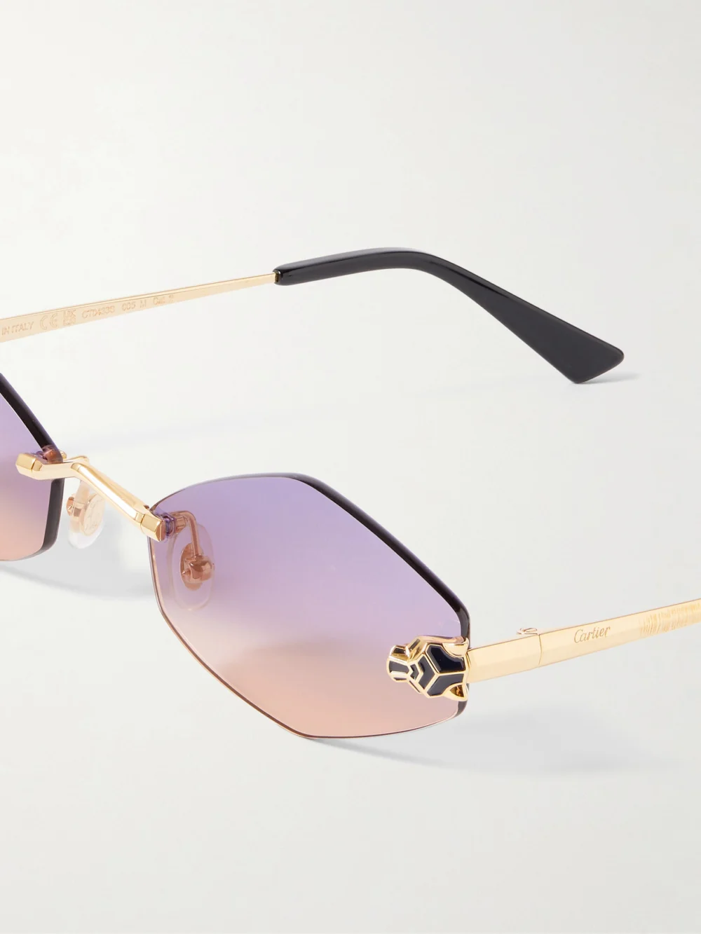 Close-up detail of the Cartier Eyewear Panthère Hexagon-frame Gold-tone Sunglasses