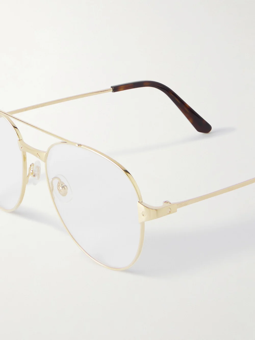 Close-up detail of the Cartier Eyewear Santos De Cartier Aviator-style Gold-tone Optical Glasses