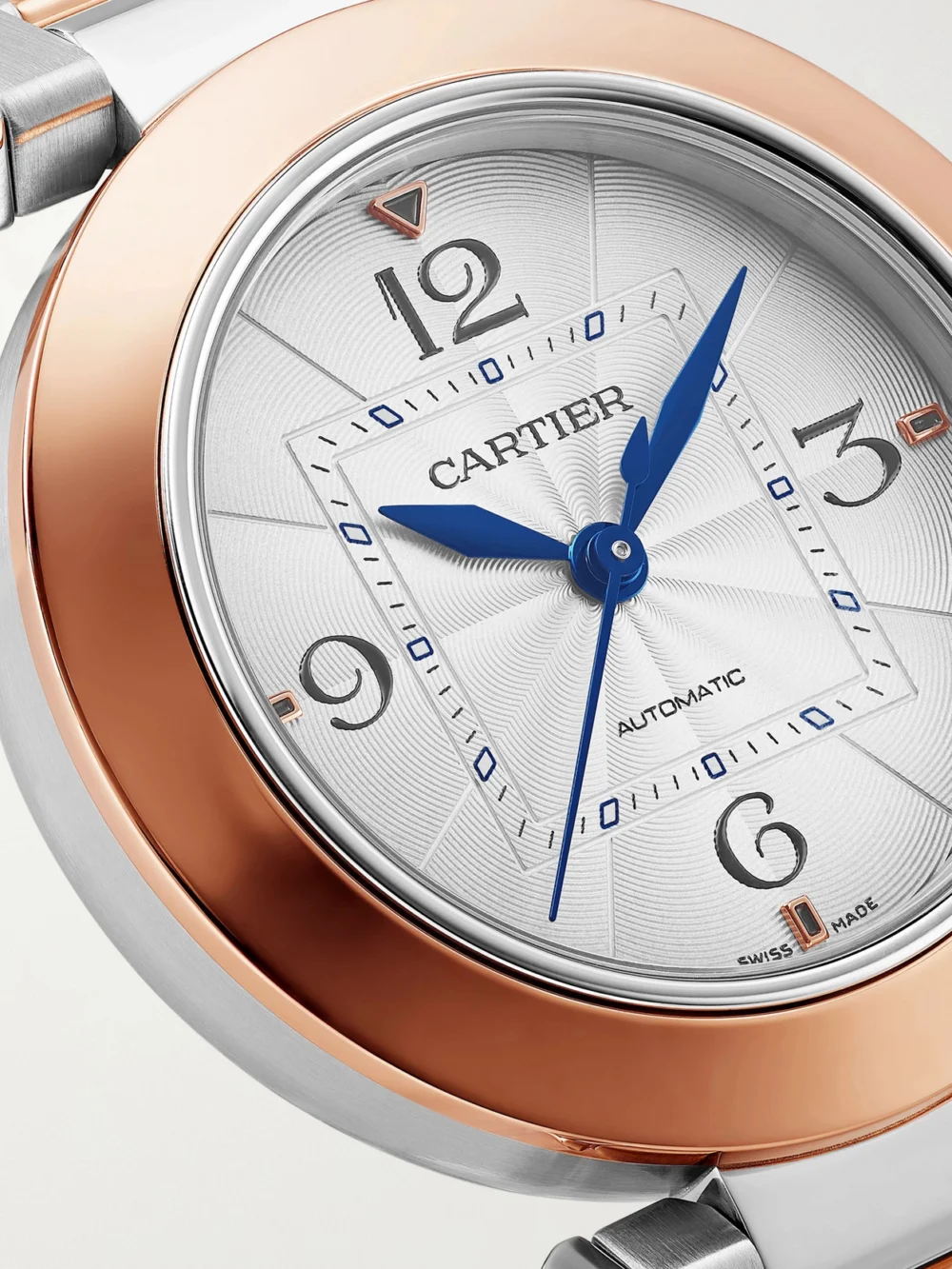 Close-up detail of the Cartier Pasha De Cartier Automatic Stainless Steel and 18-karat Rose Gold Watch