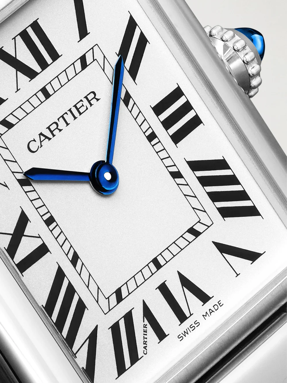 Close-up detail of the Cartier Tank Must De Cartier Large Solarbeat™ Stainless Steel Watch