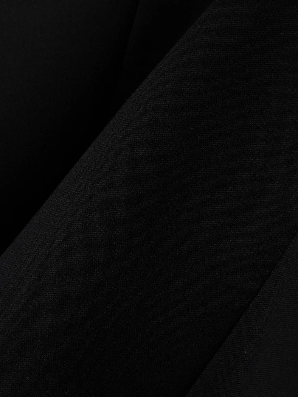 Close-up detail of the Carven Asymmetric Crepe Bustier Top